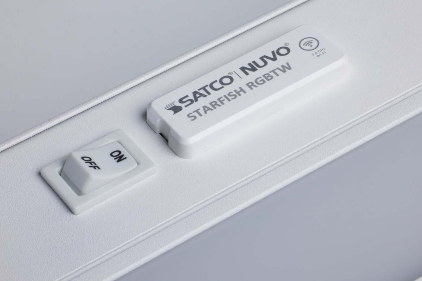Satco 11-inch LED under cabinet light with RGB and tunable white options in white finish, mounted under kitchen cabinets.