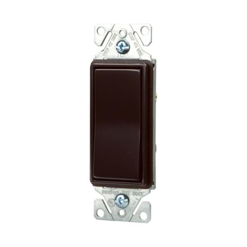 Eaton Cooper brown 15A 3-way decorator switch installed in wall, wiring device for controlling lighting circuits.