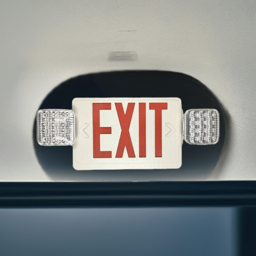 Red exit sign with emergency light, white housing, from Eiko, designed for indoor safety and emergency egress.