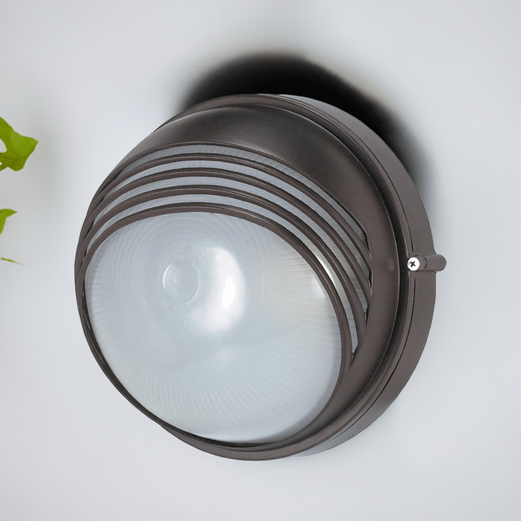 Nuvo 10-inch round hood bulkhead exterior lighting fixture in architectural bronze finish, weather-resistant outdoor wall light