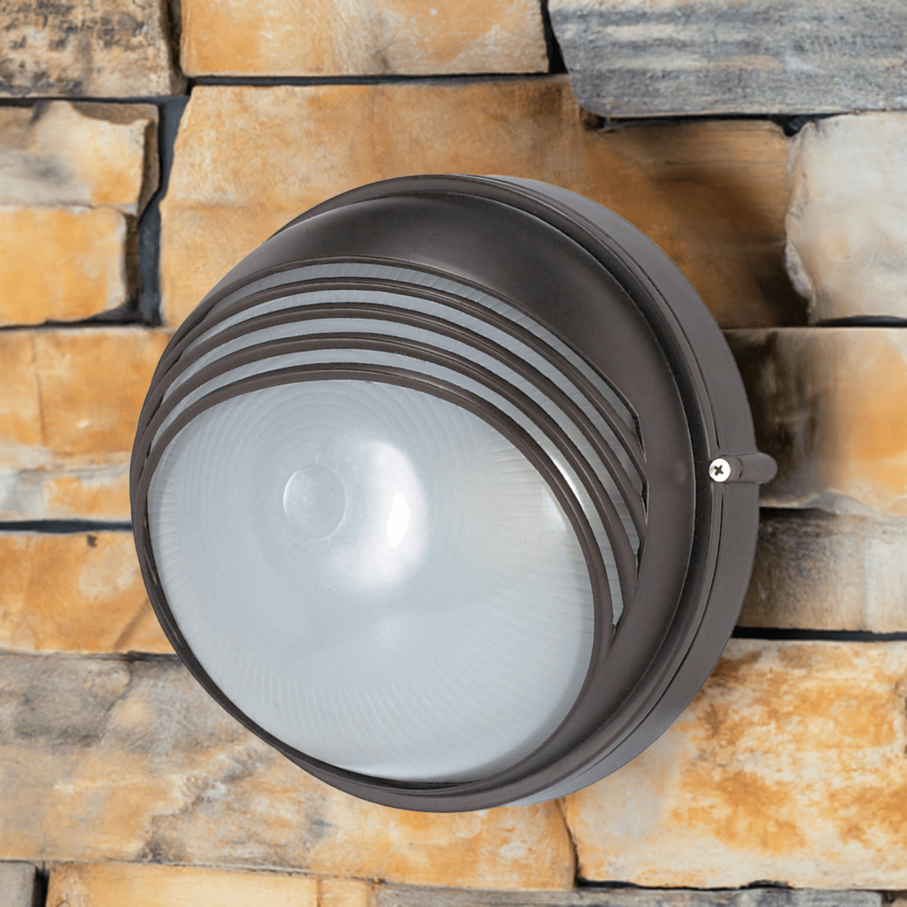 Nuvo 10-inch round hood bulkhead exterior lighting fixture in architectural bronze finish, designed for outdoor wall mounting.