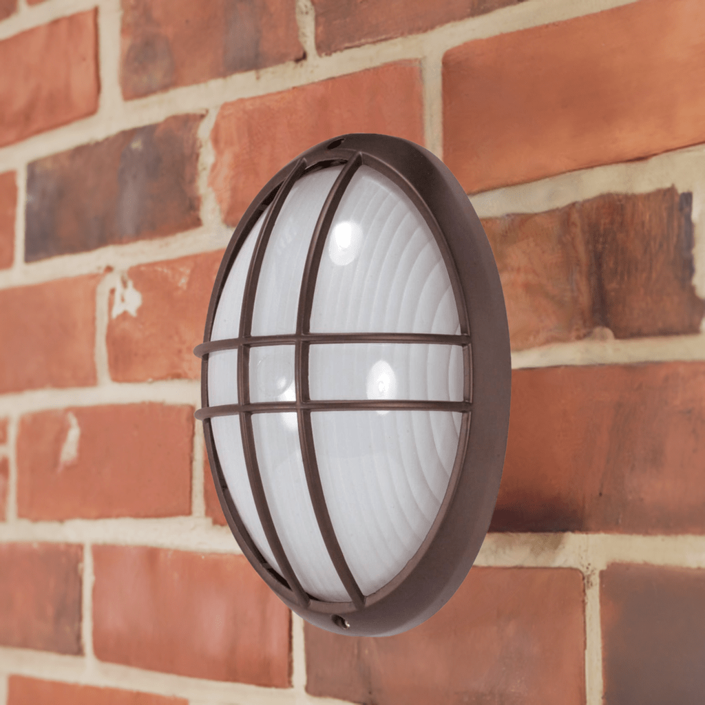 SATCO 13-inch large oval cage bulkhead exterior lighting fixture in architectural bronze finish, with protective cage and durable construction.
