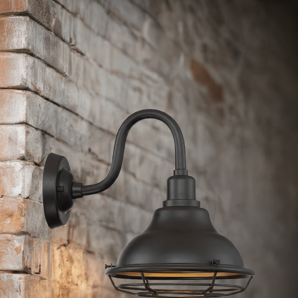 Satco 1-light exterior sconce with dark bronze and gold finish, featuring classic design and decorative wall mount for outdoor lighting.