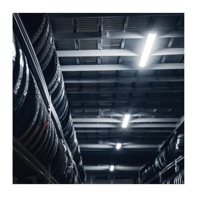 Satco 4 ft LED linear fixture with adjustable CCT, integrated emergency, sensor, suitable for stairwells and commercial spaces.