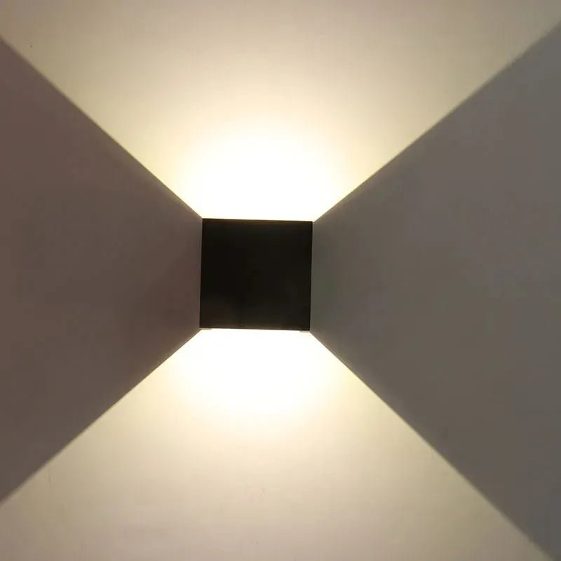 Bronze wall-mounted exterior light fixture with adjustable beam angle and 15W CCT, by Westgate.