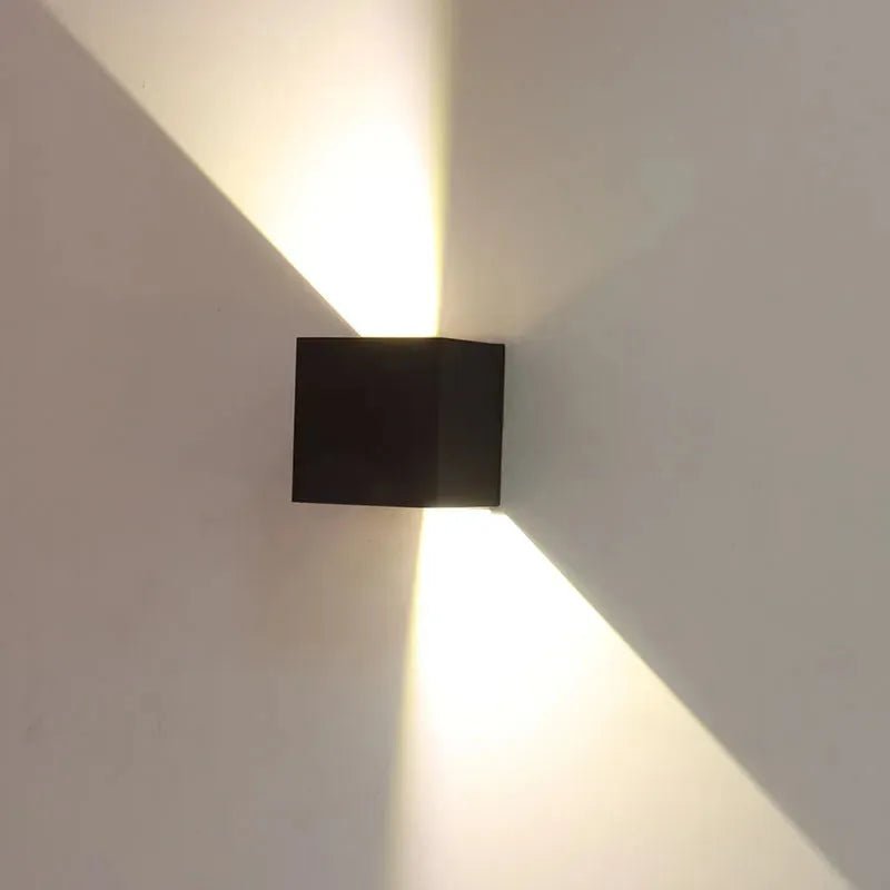 Bronze wall-mounted exterior lighting fixture by Westgate with adjustable beam angle, 15W CCT outdoor wall cube light.