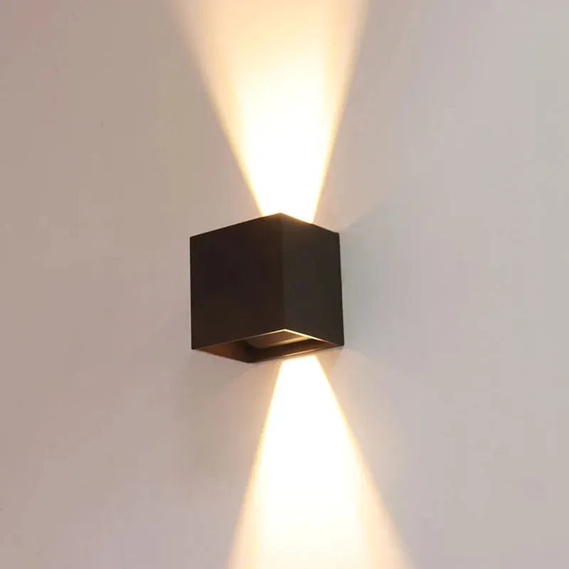 Bronze wall-mounted exterior light fixture with adjustable beam angle, 15W CCT, by Westgate for outdoor lighting.