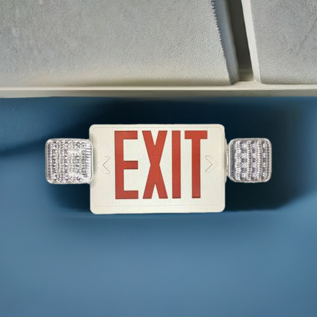 Eiko red exit sign with emergency light, white housing, mounted on wall, illuminated for safety and visibility.